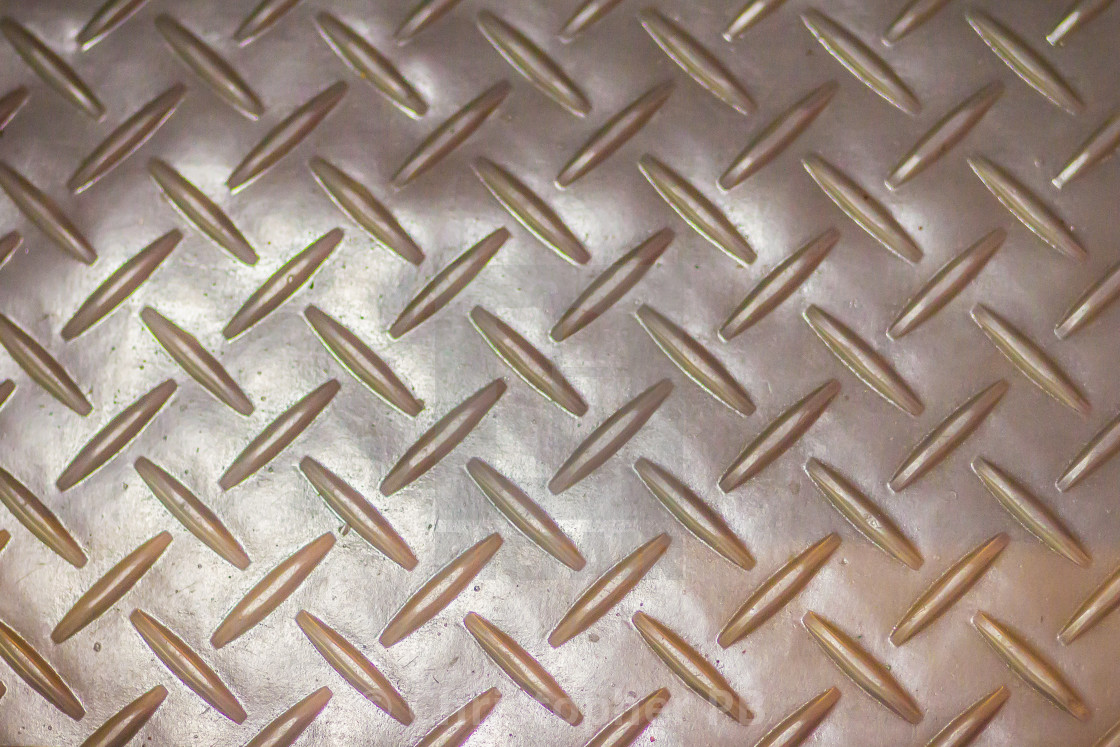 Rusty steel diamond plate texture background. Grungy metal floor